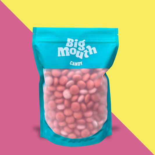 Big Mouth Candy pick and mix bag filled with pink, round sweets. The resealable teal pouch features a clear window showcasing the candy inside, with bold white branding on the front. Perfect for pick and mix sweets, sweet bags, and candy delivery across Northern Ireland. A must-have addition to any sweet box or pick and mix selection