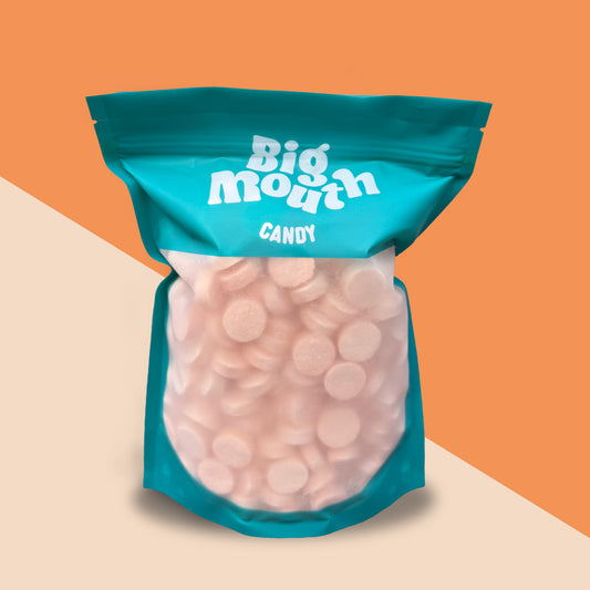 Big Mouth Candy pick and mix bag filled with cinnamon lozenges. The resealable teal pouch features a transparent window showcasing the sweet, fiery treats inside. Perfect for pick and mix sweets, candy lovers, and sweet bags, this vibrant packaging stands out. Ideal for pick and mix UK delivery, sweet box collections, and candy box enthusiasts. Available online for candy delivery across Northern Ireland, including Royal Hillsborough