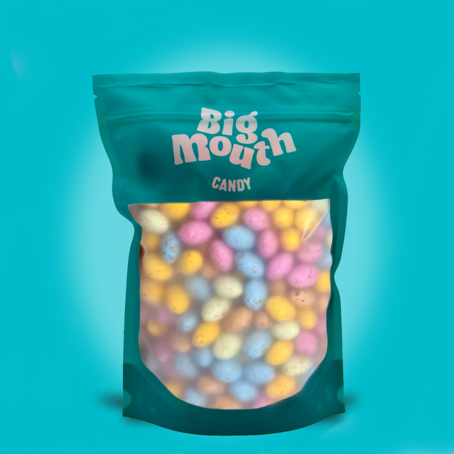 Bag of colorful chocolate eggs labeled 'Big Mouth Candy' on a teal background