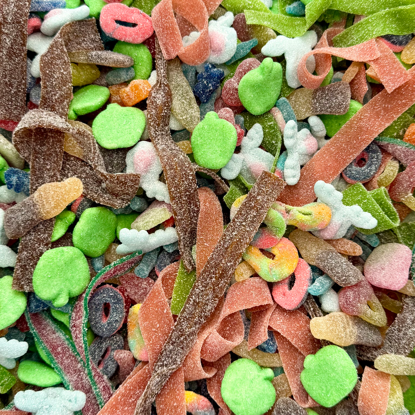 Close up of fizzy pick and mix sweets showing sugar coating and sour textures