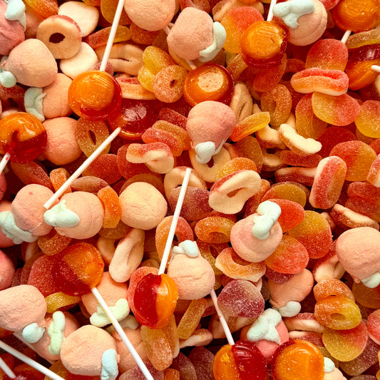 Peach themed pick and mix sweets including peach rings, peach marshmallows and orange lollipops from Big Mouth Candy