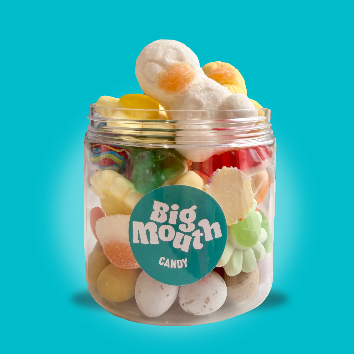 Spring Treats Jar 210g from Big Mouth Candy filled with mini eggs, jelly sweets, bunny sweets and marshmallow treats in a clear jar on a blue background